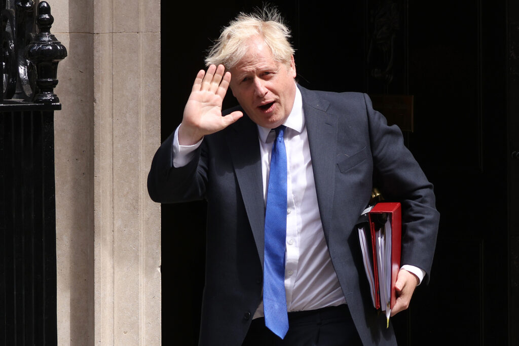 Boris Johnson waves as he leaves 10 Downing Street